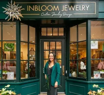 Founder Stacey Krantz at InBloom Jewelry's brick and mortar location on East Patrick Street.  Photo