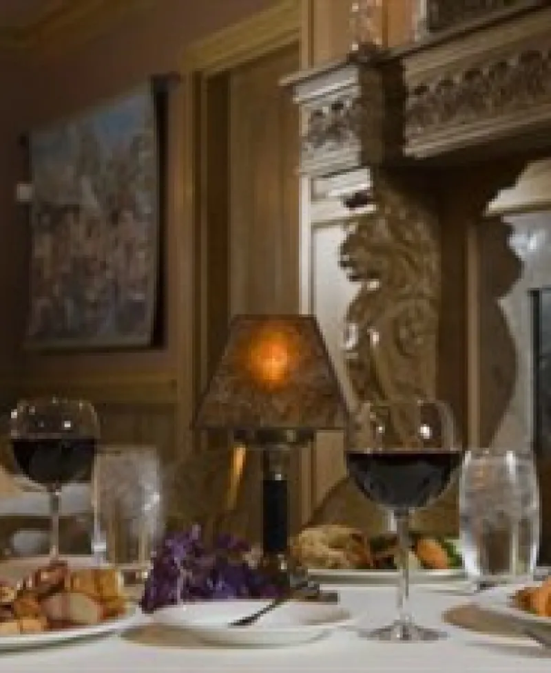 Romantic dinner for two by the fireplace. Photo